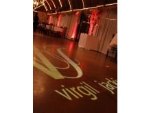 A beautiful custom monogram and uplighting for Jackie and Virgil's wedding